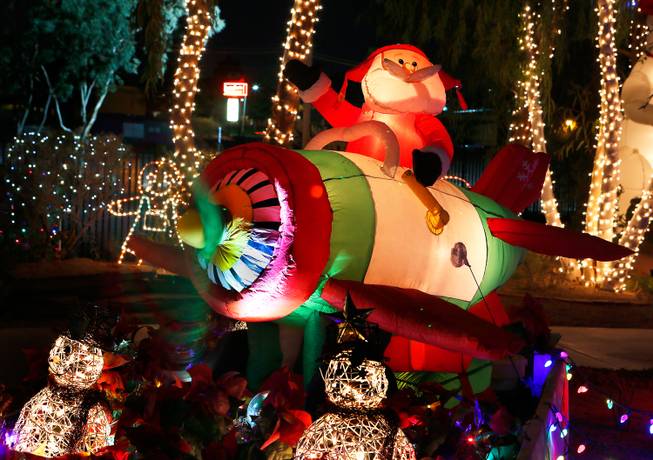 The Cactus Garden at Ethel M Chocolate Factory is lit with holiday lights, some blow-up characters, too, like Santa, on Wednesday, Nov. 19, 2014, in Henderson.


