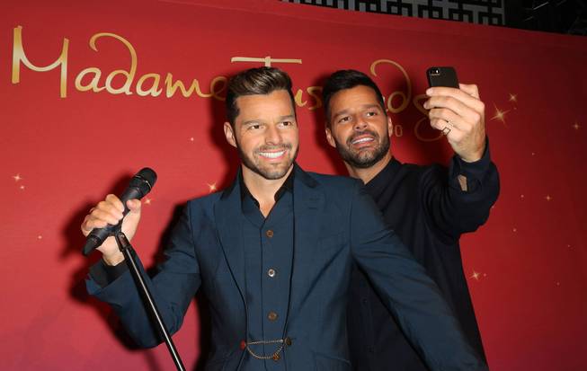 Ricky Martin's wax figure, left, is posed with the real Ricky Martin at Madame Tussauds at the Venetian on Wednesday, Nov. 19, 2014.