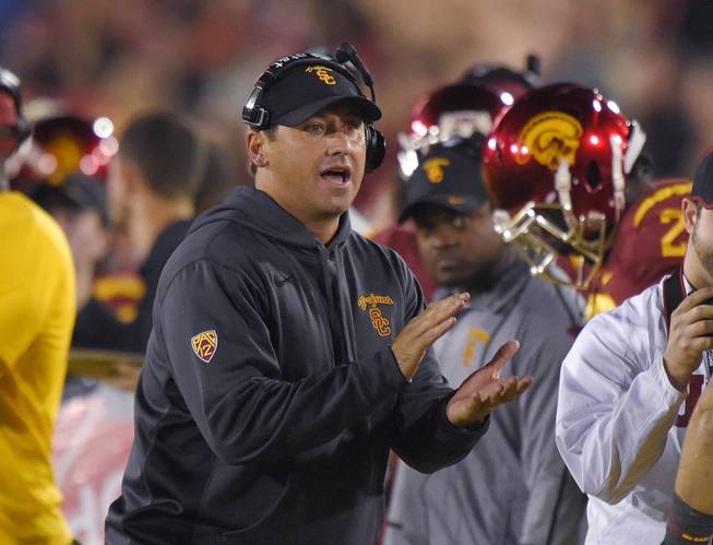 Southern California coach Steve Sarkisian claps during the second half of an NCAA college football game against California, Thursday, Nov. 13, 2014, in Los Angeles. USC won 38-30. (AP Photo/Mark J. Terrill)