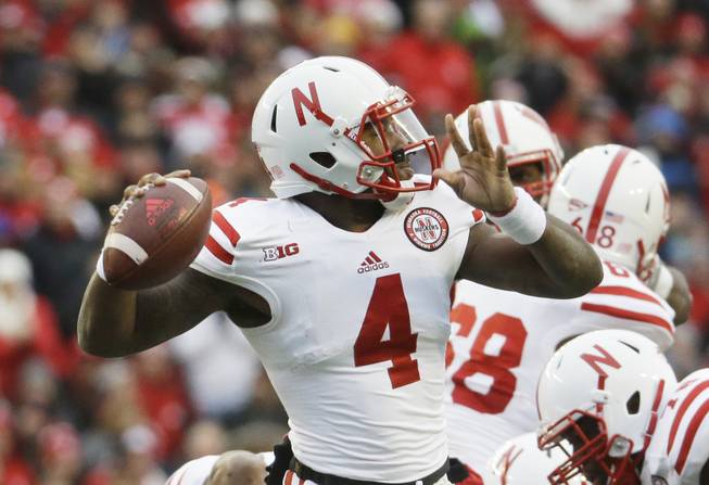 Nebraska quarterback Tommy Armstrong Jr. reaches back to pass during the first half of an NCAA college football game against Wisconsin Saturday, Nov. 15, 2014, in Madison, Wis. (AP Photo/Morry Gash)