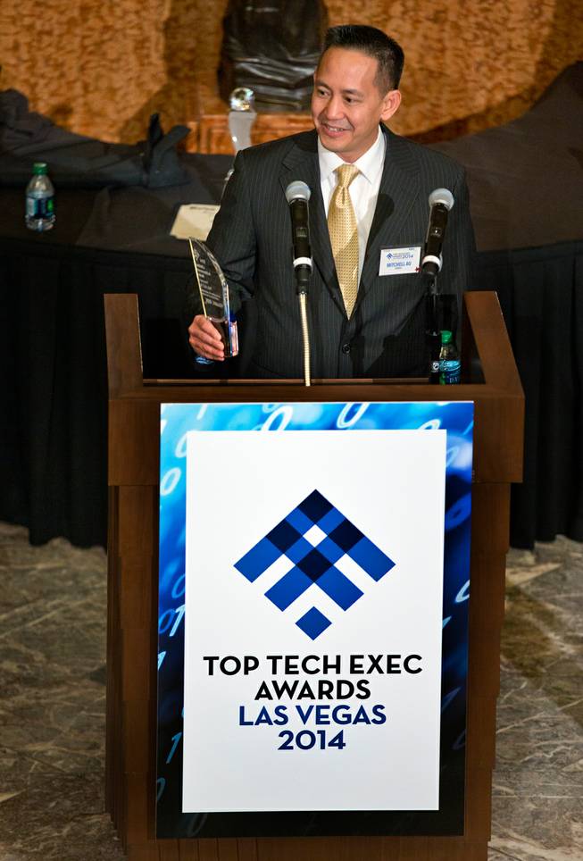 Senior IT Manager Mitchell Au with Comprehensive Cancer Centers of Nevada wins the Lifetime Achievement Award during the Top Tech Exec awards at the Smith Center sponsored by Vegas Inc and Cox on Thursday, November 20, 2014.