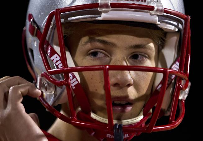Liberty High School QB Kenyon Oblad eyes his coach as they prepare to face Basic on Friday, Nov. 21, 2014. 