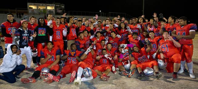 Liberty players pose for a group shot after beating Basic in the Sunrise Regional championship game on Friday, November 21, 2014.