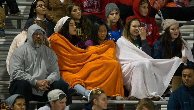 Liberty fans bundle up as they watch their players beat Basic at the Sunrise Regional championship game on Friday, November 21, 2014.