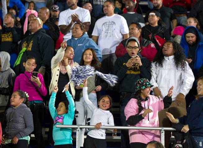 Desert Pines fans cheer their team on versus Moapa Valley in the Division I-A state high school football championship game on Saturday, November 22, 2014.