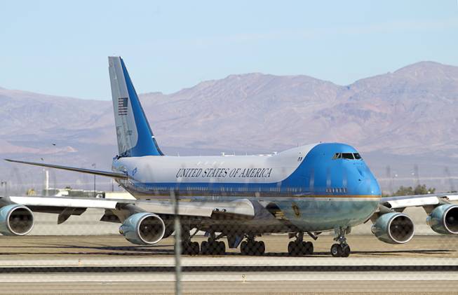 Air Force One taxis to the runway at McCarran International Airport as President Obama leaves Las Vegas Sunday, Nov. 23, 2014.