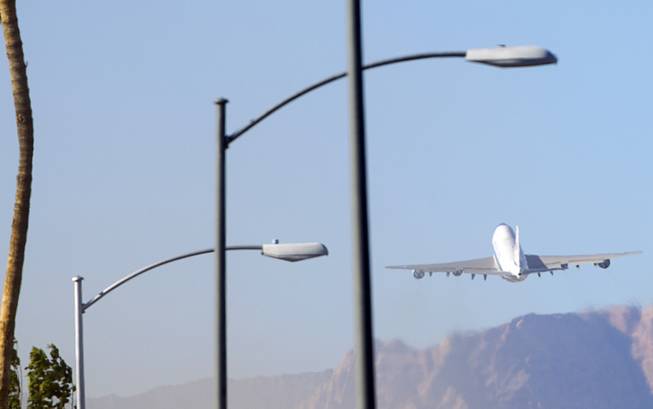 Air Force One takes off from McCarran International Airport as President Obama leaves Las Vegas Sunday, Nov. 23, 2014.