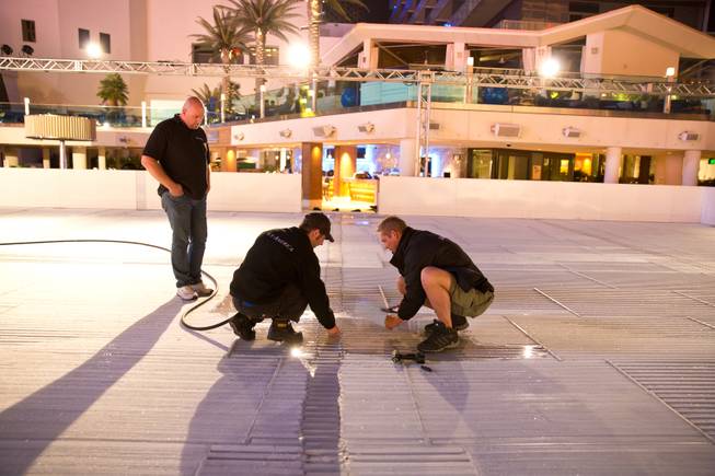 Installation of an ice-skating rink and festive winter lounge is in progress at the Cosmopolitan on Thursday, Nov. 13, 2014, in Las Vegas.