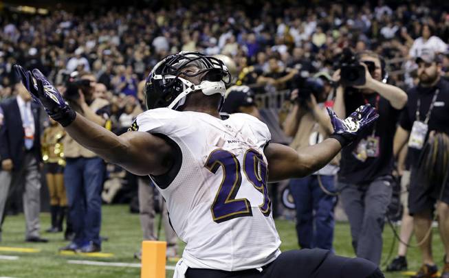 Baltimore Ravens running back Justin Forsett celebrates his touchdown carry in the second half of an NFL football game against the New Orleans Saints in New Orleans, Monday, Nov. 24, 2014. The Ravens won 34-27. 