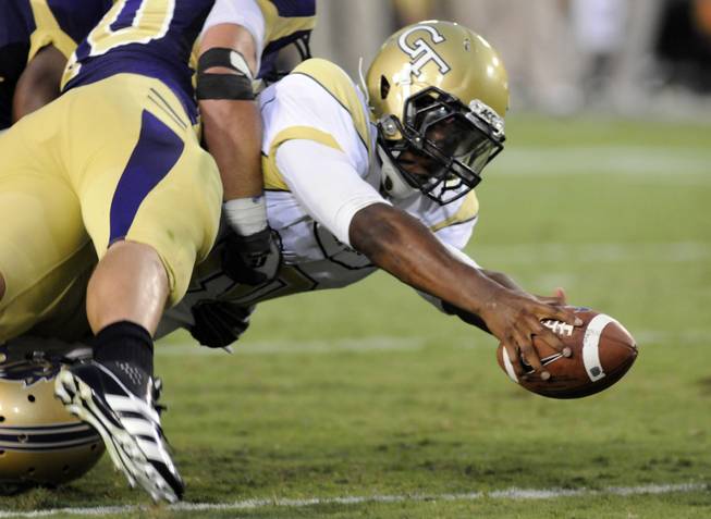 Georgia Tech quarterback Synjyn Days reaches the ball across the goal line to score a touchdown against Western Carolina during an NCAA college football in Atlanta, Thursday, Sept. 1, 2011. AP Photo/Billy Weeks)