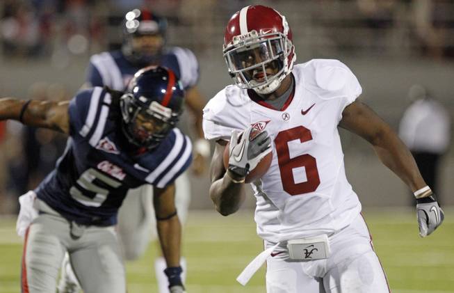 Alabama back Blake Sims (6) runs past Mississippi safety Frank Crawford (5) for a 45-yard gain in the fourth quarter of an NCAA college football game in Oxford, Miss., Saturday, Oct. 15, 2011. No. 2 Alabama won 52-7. (AP Photo/Rogelio V. Solis)
