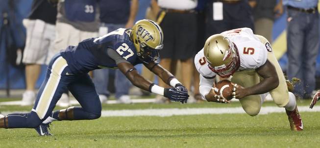 Florida State's Reggie Northrup (5) recovers a fumble his returner dropped on a kickoff as Pittsburgh defensive back Trenton Coles (27) pursues in the first quarterof the NCAA football game, Monday, Sept. 2, 2013 in Pittsburgh. (AP Photo/Keith Srakocic)