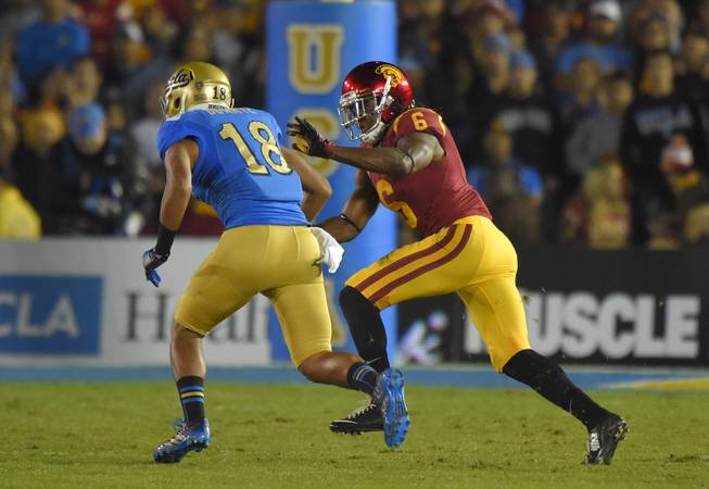 Southern California cornerback Josh Shaw, right, guards UCLA wide receiver Thomas Duarte during the first half of an NCAA college football game, Saturday, Nov. 22, 2014, in Pasadena, Calif. (AP Photo/Mark J. Terrill)