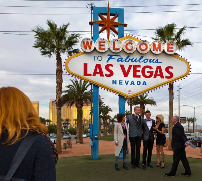 Chrissie Hynde, Dan Mathews, Jack Ryan, Pamela Anderson and Paul DeVido at the Welcome to Fabulous Las Vegas sign Thursday, Nov. 27, 2014. Mathews of People for the Ethical Treatment of Animals married his longtime partner Ryan there in a small wedding party.
