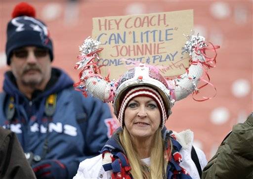 A fan displays a sign in support of Cleveland Browns quarterback Johnny Manziel before an NFL football game against the Houston Texans Sunday, Nov. 16, 2014, in Cleveland.