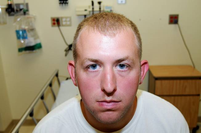 Ferguson police officer Darren Wilson is shown during his medical examination after he fatally shot Michael Brown, in Ferguson, Mo.