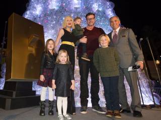 Tori Spelling, Dean McDermott, their four kids and Venetian headliners Human Nature celebrate the lighting of the Christmas tree Tuesday, Nov. 25, 2014, at the Venetian.