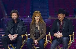 Ronnie Dunn, Reba McEntire and Kix Brooks respond to questions during a news conference in the Colosseum on Wednesday, Dec. 3, 2014, at Caesars Palace. The new residency 