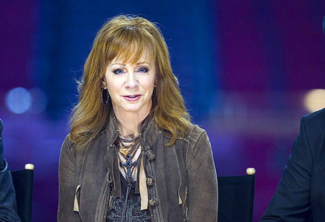 Reba McEntire responds to a question during a news conference ...
