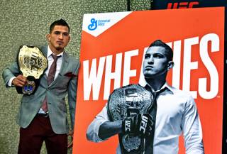 Lightweight title belt holder Anthony Pettis stands next to a large Wheaties box cover her is featured on during the UFC 181 Media Day at the MGM Grand on Thursday, December 4, 2014. Pettis is the first ever UFC fighter to have that honor.