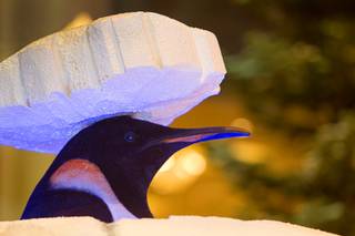 A animatronic penguin peeks out from the top of an igloo  in the Bellagio Conservatory & Botanical Garden at the Bellagio Thursday, Dec. 4, 2014.