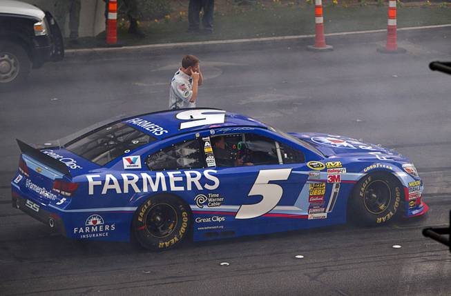 Kasey Kahne waits to do a burnout at Harmon Avenue during a NASCAR Victory Lap on the Las Vegas Strip Thursday, Dec. 4, 2014. The annual event is part of the NASCAR Champion's Week.