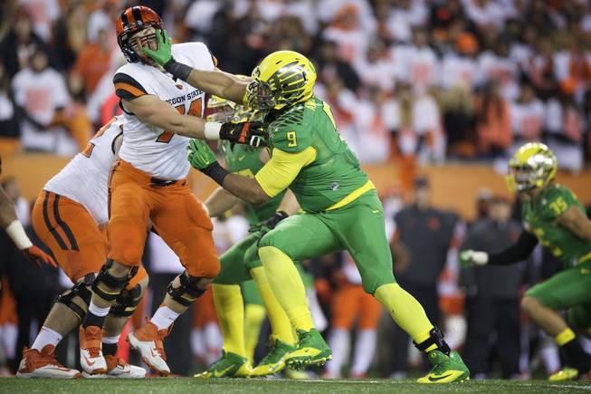 Oregon defensive end Arik Armstead (9) gets around Oregon State tackle Dustin Stanton (74) during an NCAA college football game in Corvallis, Or., Saturday, Nov. 15, 2014. Oregon beat Oregon State 47-19.