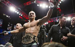 New welterweight title belt holder Robbie Lawler celebrates with fans after his UFC 181 fight win at the Mandalay Bay Events Center on Saturday, Dec. 6, 2014. 
