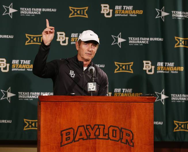 Baylor NCAA college head football coach Art Briles responds to questions during a press conference Sunday, Dec. 7, 2014, in Waco, Texas. After weeks of talk about whether Baylor or TCU deserved to be in the playoff, neither made it Sunday, and the Big 12 may be reconsidering how to declare its champion.
