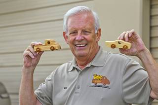 Founder Rex Doty poses at the Toys 4 Smiles workshop Monday, Dec. 8, 2014. The nonprofit organization started as a wood club in 2006 and will soon produce their 200,000th toy, Doty said.