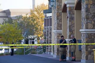 Firefighters appear to take measurements during an odor investigation at the Nevada State Welfare Division Offices in North Las Vegas Tuesday Dec. 9, 2014.
