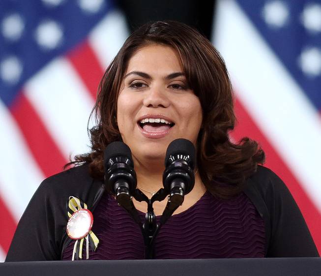 Immigration activist Astrid Silva introduces President Barack Obama before a speech on immigration at Del Sol High School Friday, Nov. 21, 2014, in Las Vegas.