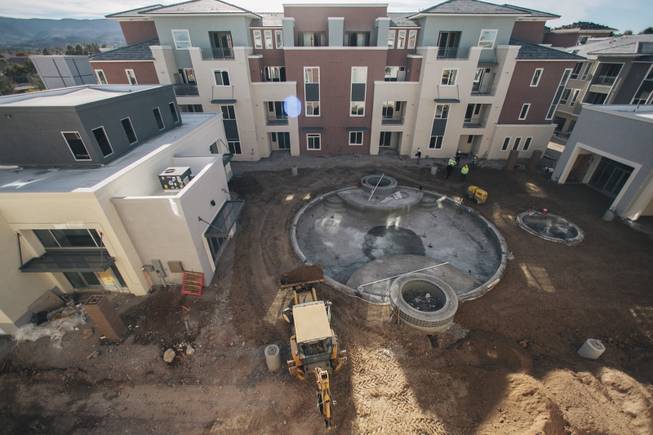 A pool is under construction at Elysian at the District at Green Valley Ranch, an apartment complex at 2151 Village Walk Drive, on Wednesday, Dec. 10, 2014.
