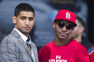 Welterweight boxers Amir Khan, left, of Britain and Devon Alexander of St. Louis, Mo. pose during a final news conference at the MGM Grand Thursday, Dec. 11, 2014. Khan and Alexander will fight in a welterweight fight at the MGM Grand Garden Arena Saturday.