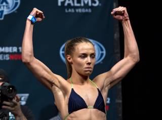 Strawweight fighter Rose Namajunas raises her arms to the crowd after weighing in for the Ultimate Fighter reality show finale live from the Pearl at the Palms Casino on Thursday, December 11, 2014.