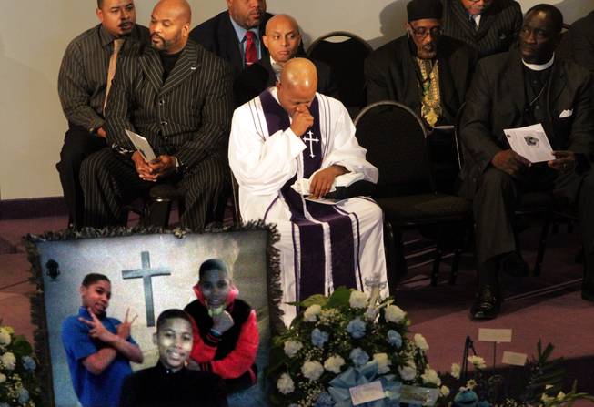 Pastor Henry Currie of Mary B. Wise Baptist Church collects himself during services for Tamir Rice, Wednesday, Dec. 3, 2014, in Willoughby, Ohio. Rice, 12, was shot and killed by a Cleveland police officer late last month. Police told The Plain Dealer the rookie officer who shot Rice believed the replica gun he waved was a real firearm. 