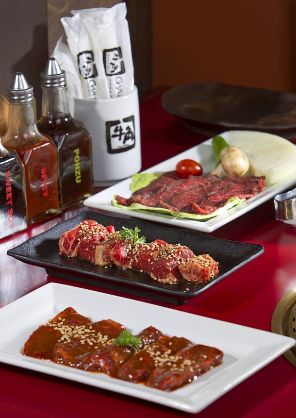 Harumi skirt steak, foreground, Angus finger rib, center, and Kobe-style flat iron steak with vegetables are shown at Gyu-Kaku Japanese BBQ, 3550 S. Decatur Blvd., Sunday, Dec. 14, 2014.