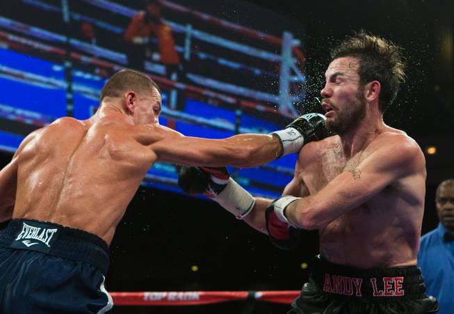 Matt Korobov connects with a glancing blow to the chin of Andy Lee during a fight for the vacant WBO middleweight title at the Cosmopolitan on Saturday, December 13, 2014.