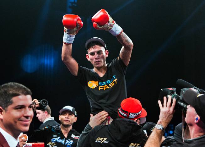 Jose Benavidez Jr. celebrates with members of his camp after defeating Mauricio Herrera in a interim WBA super lightweight title fight at the Cosmopolitan on Saturday, Dec. 13, 2014.