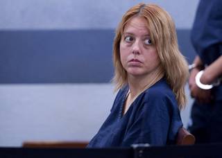 Terrie Sena, 43, waits for a court appearance at the Regional Justice Center in Las Vegas Tuesday, Dec. 16, 2014. Along with ex-husband Christopher Sena, 48, and his wife, Debra Sena, 50, Terrie Sena is accused of participating in sexual abuse that lasted 12 years and affected at least eight victims, some of whom are family members, according to Metro Police.