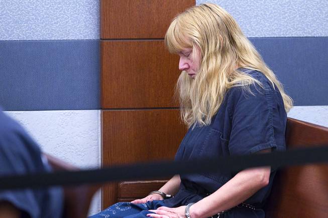 Debra Sena, 50, waits for a court appearance at the Regional Justice Center in Las Vegas Tuesday, Dec. 16, 2014. Along with husband Christopher Sena, 48, and his ex-wife, Terrie Sena, Debra Sena is accused of participating in sexual abuse that lasted 12 years and affected at least eight victims, some of whom are family members, according to Metro Police.