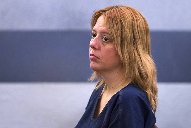 Terrie Sena, 43, waits for a court appearance at the Regional Justice Center in Las Vegas Tuesday, Dec. 16, 2014. Along with ex-husband Christopher Sena, 48, and his wife, Debra Sena, 50, Terrie Sena is accused of participating in sexual abuse that lasted 12 years and affected at least eight victims, some of whom are family members, according to Metro Police.