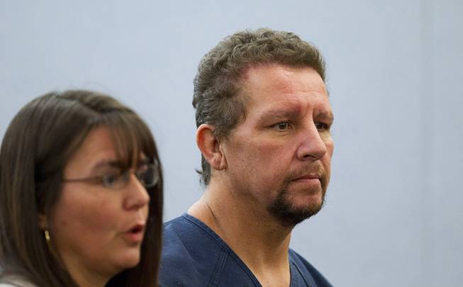 Christopher Sena, right, 48, listens as public defender Violet Radosta speaks to the judge during a court appearance at the Regional Justice Center in Las Vegas Tuesday, Dec. 16, 2014. Sena is accused of participating in sexual abuse that lasted 12 years and affected at least eight victims, some of whom are family members, according to Metro Police.