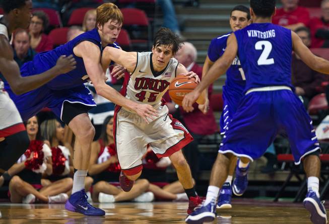 UNLV guard Cody Doolin (45) drives through Portland players late in the game at the Thomas & Mack Center on Wednesday, December 17, 2014.