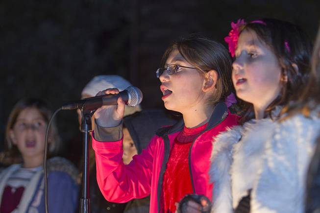 Members of the Ner Tamid Choir perform during a Hanukkah menorah lighting ceremony in The District in Henderson Thursday, Dec. 18, 2014. The event, celebrating the third night of Hanukkah, was organized by Chabad of Green Valley.