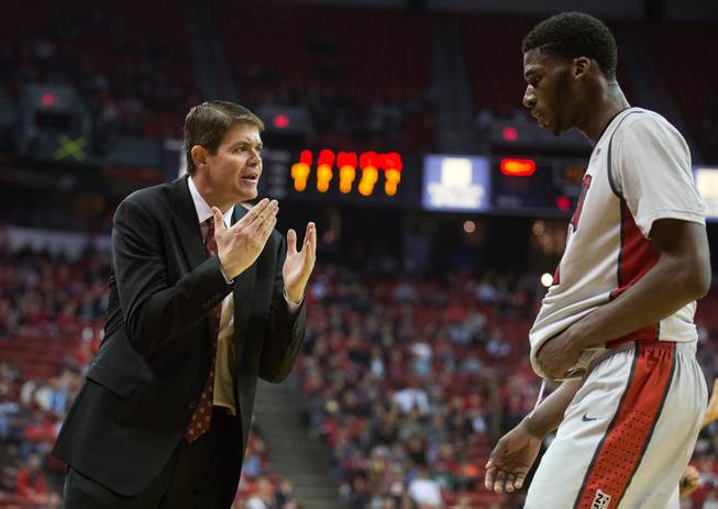 UNLV head coach Dave Rice impresses a point on his player UNLV forward Goodluck Okonoboh (11) during their game at the Thomas & Mack Center on Wednesday, December 17, 2014.