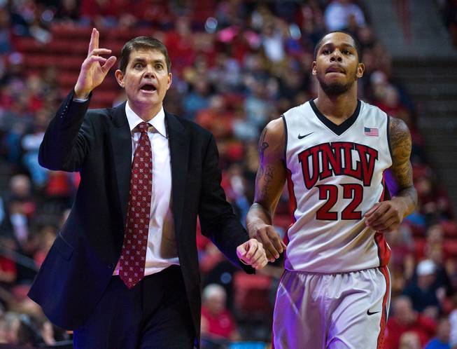 UNLV head coach Dave Rice calls a late-game play as he subs out UNLV guard Jelan Kendrick (22) against Portland at the Thomas & Mack Center on Wednesday, December 17, 2014.