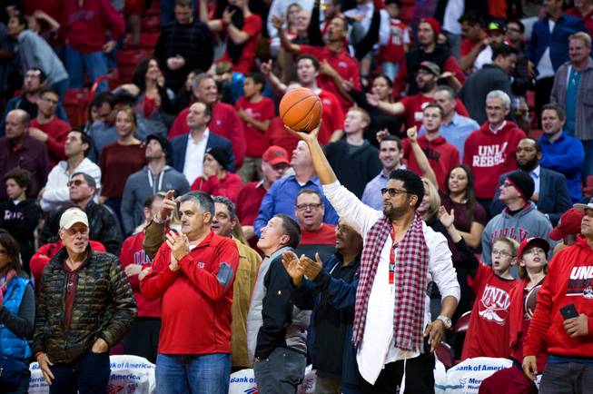 UNLV fans are on their feet as the team takes the lead late in overtime versus Portland at the Thomas & Mack Center on Wednesday, December 17, 2014.