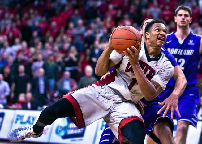 UNLV guard Rashad Vaughn (1) drives to the basket for a critical late-game score versus Portland at the Thomas & Mack Center on Wednesday, December 17, 2014.