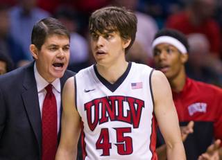 UNLV head coach Dave Rice shouts orders to UNLV guard Cody Doolin (45) and teammates during their  basketball versus Utah at the MGM Garden Arena on Saturday, December 20, 2014.